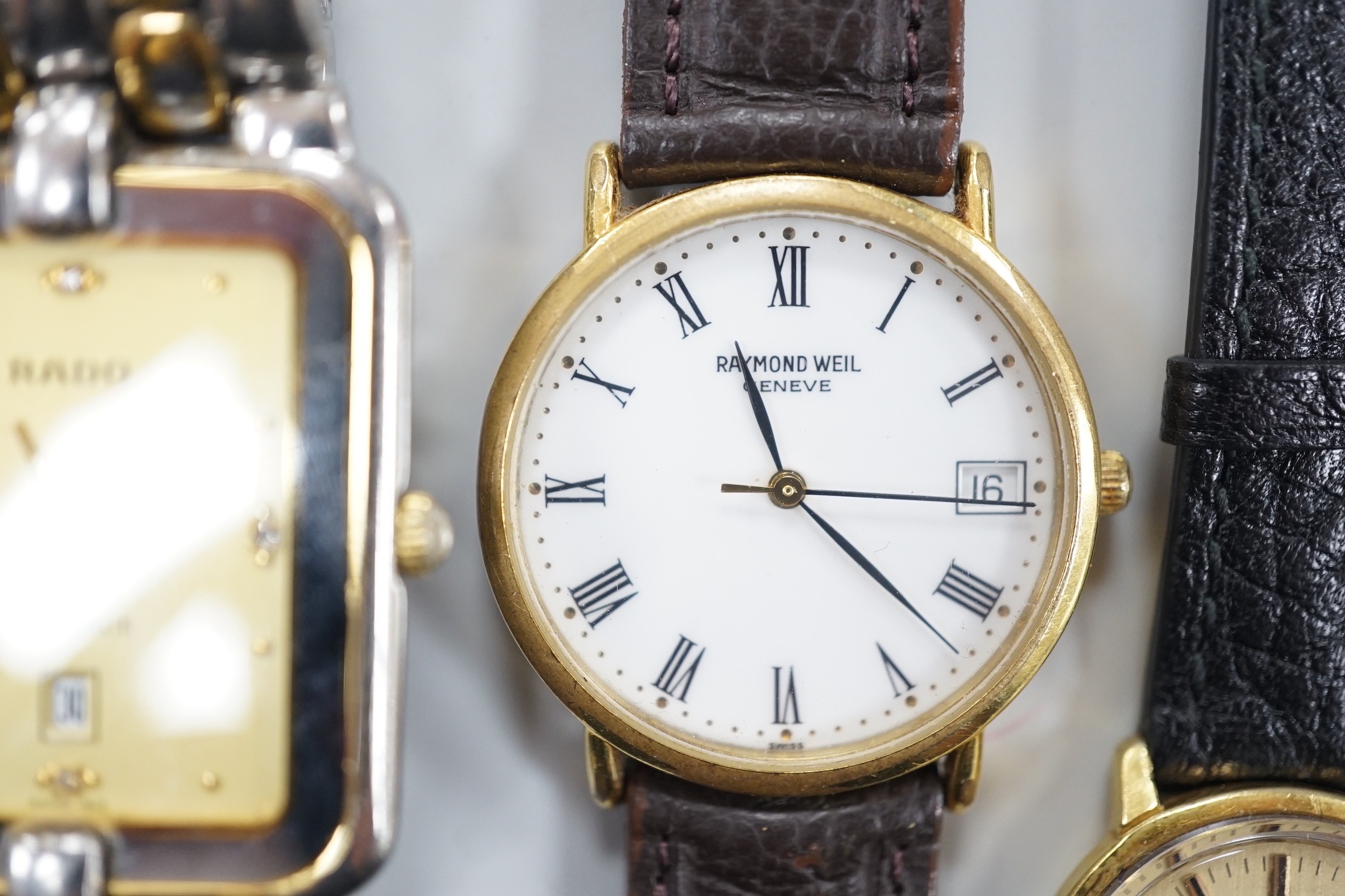 Five assorted wrist watches including lady's gold plated Omega De Ville, with box, a lady's and gentleman's steel and gold plated Rado, Raymond Weil and Casio digital.